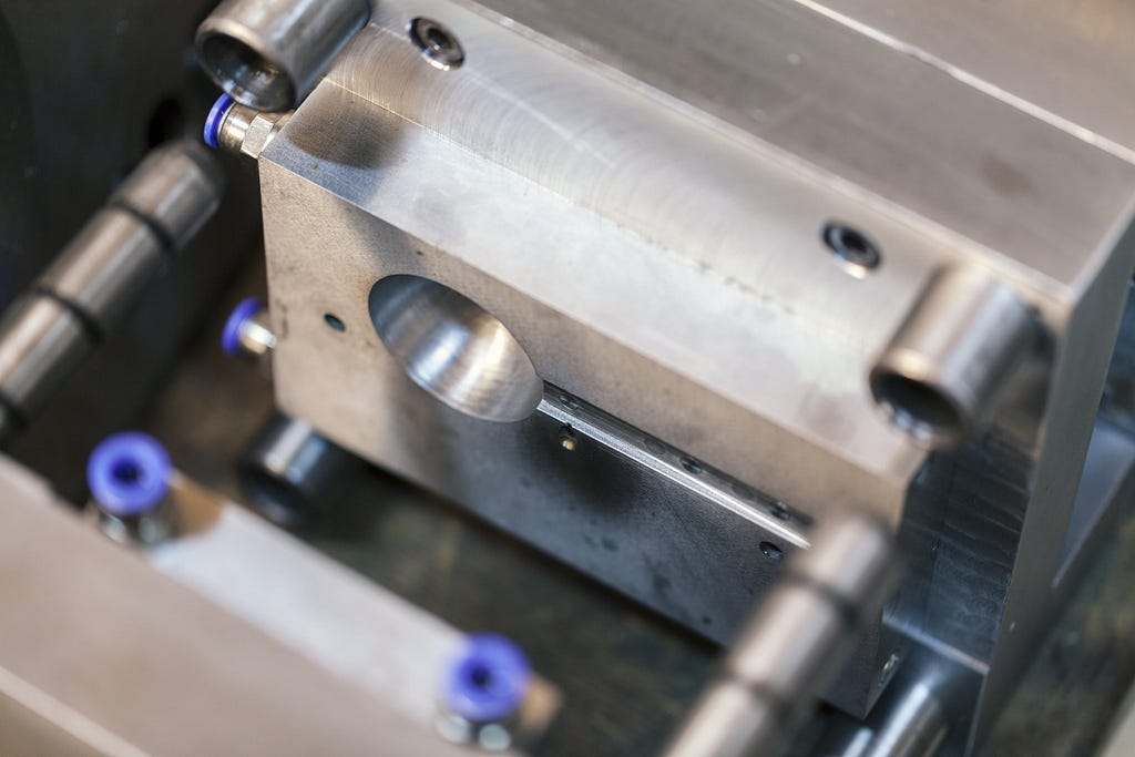 High-quality machined aluminum or steel molds are custom-made for each product design