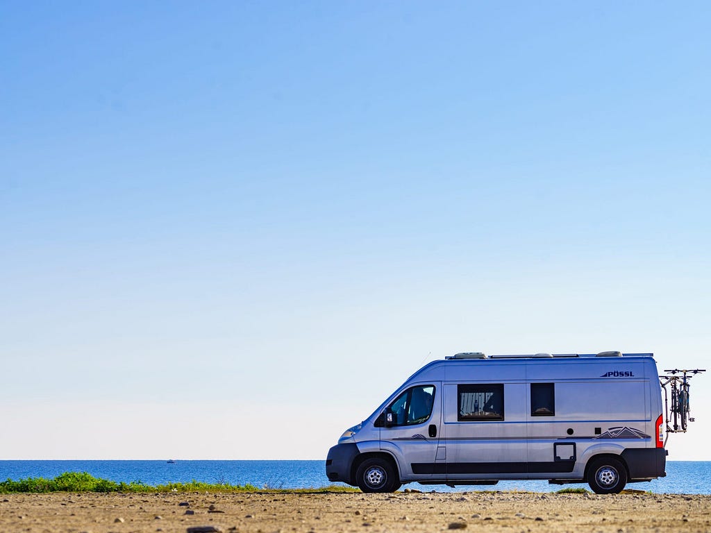 A van next to the beach.