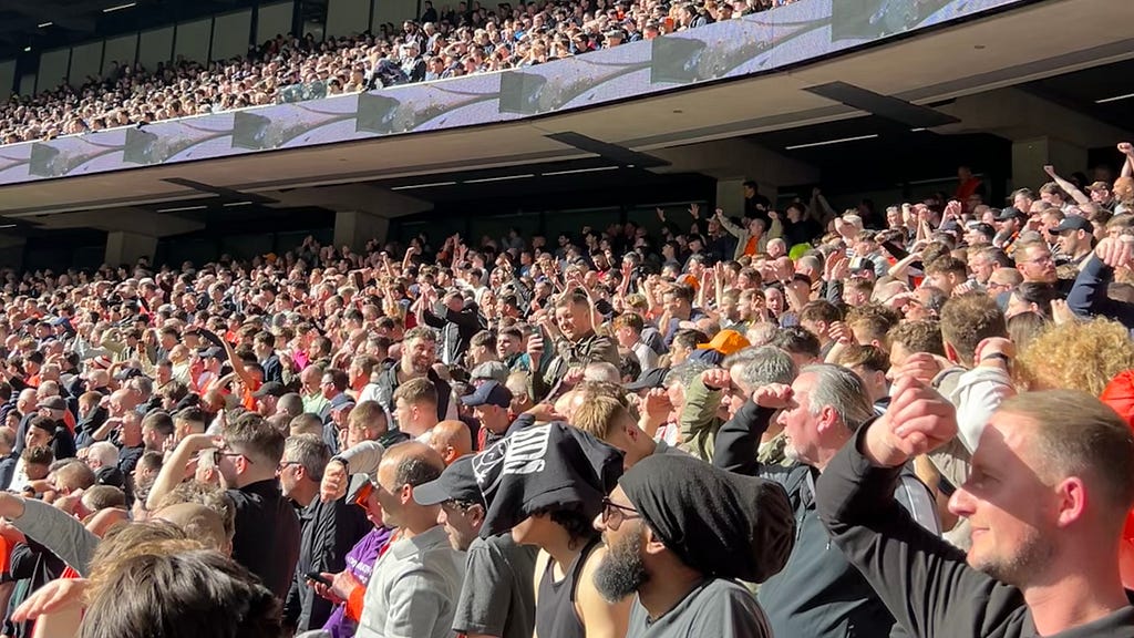 Luton fans squint in the sun at Tottenham away