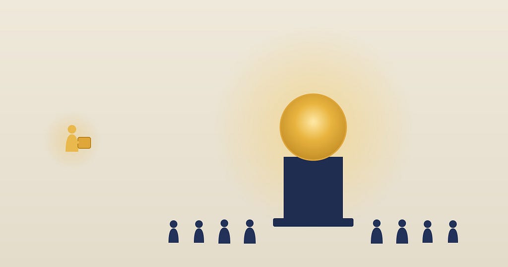 A crowd of small dark figures gathered around a large glowing gold orb on a pedestal, all turned to face it. Off to the left, ignored, a single gold figure holds a small finished object no one has turned to see.