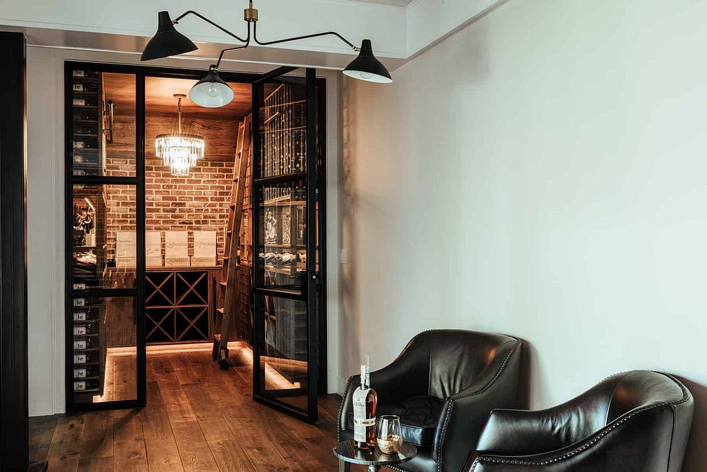 A mix of modern and rustic style makes for a gorgeous pairing in this custom wine room by Sommi Wine Cellars.