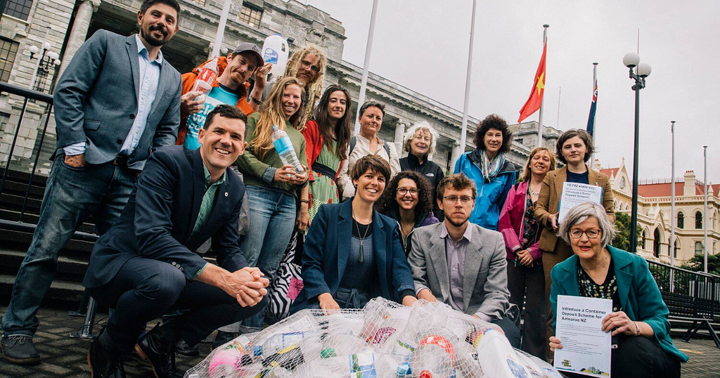 The Kiwi Bottle Drive delivering the petition at Parliament steps with politicians