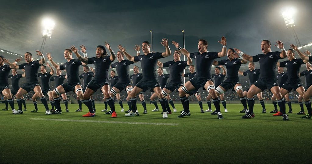 The All Blacks performing a Haka in the night