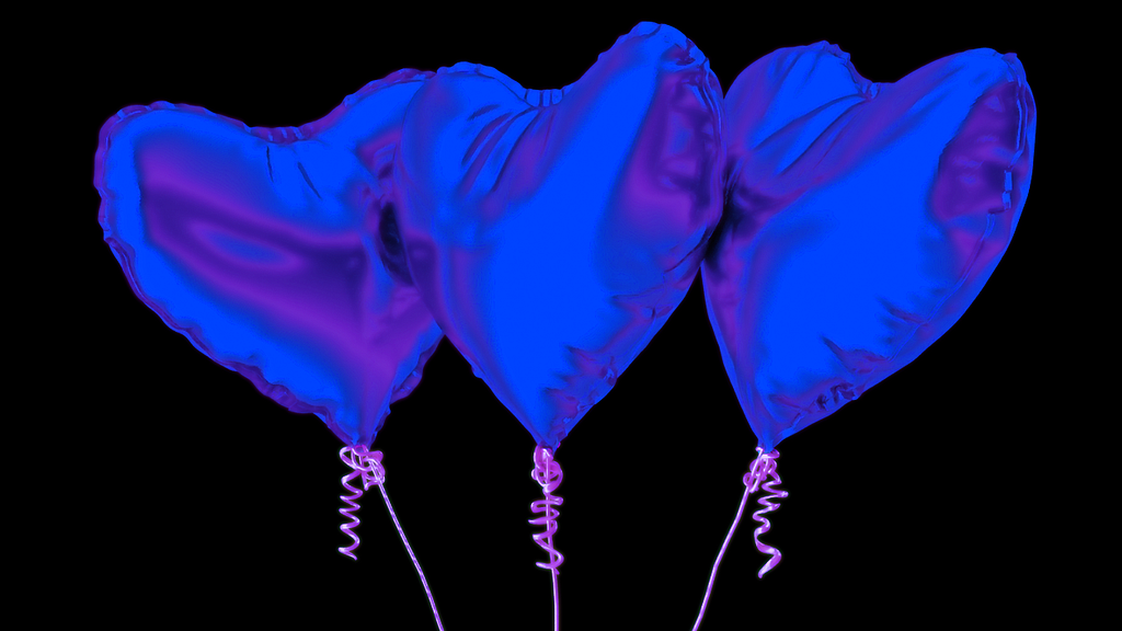 Three iridescent blue balloons on pink string.