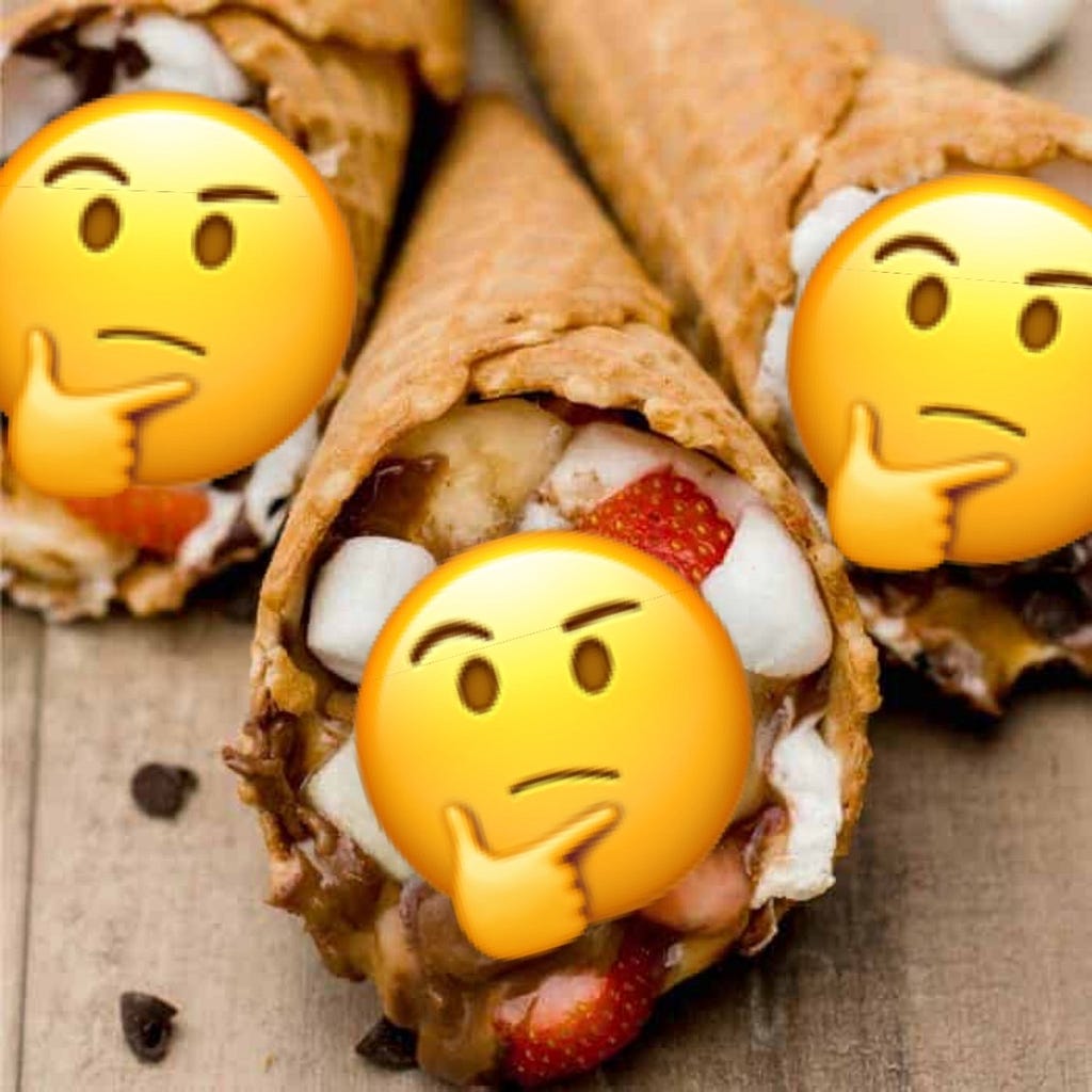 Strawberry s’mores ingredients in ice cream cones, with confused emojis on top