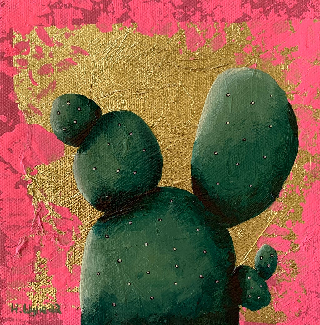 A cactus on a background of gold leaf with neon pink around it.