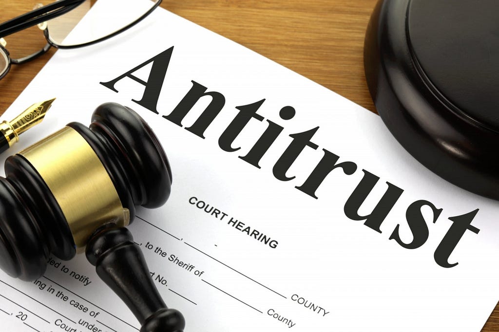 Antitrust regulation doc on desk with gavel