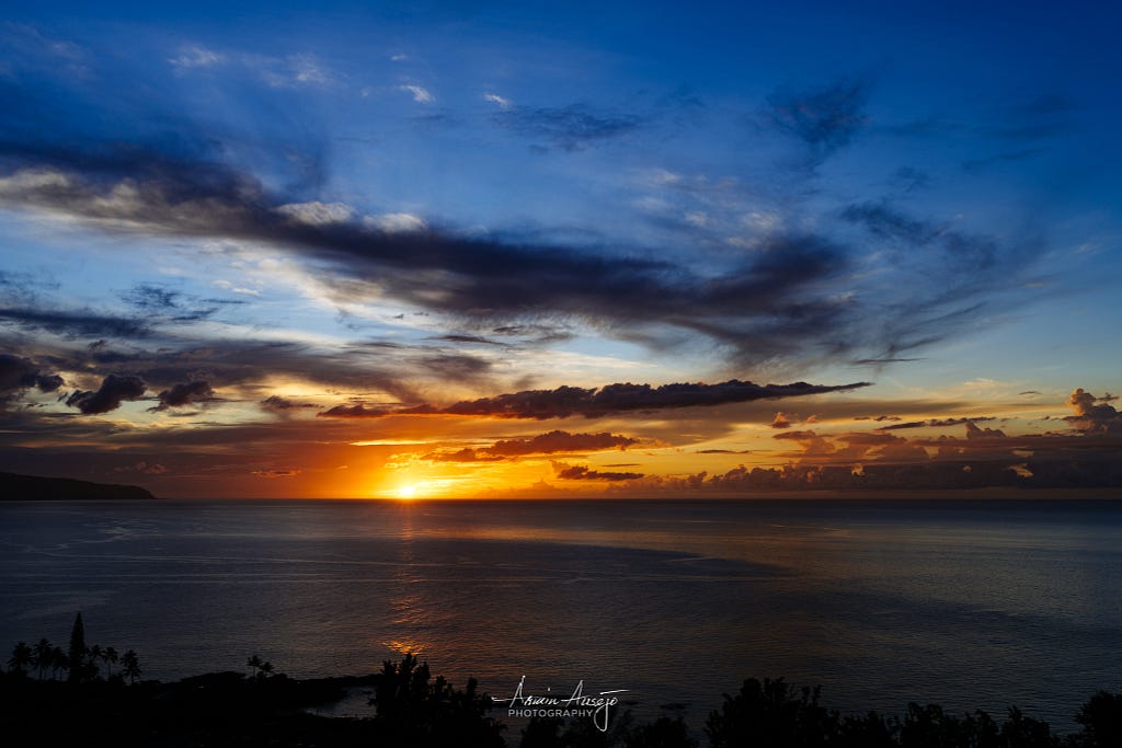 The sunset over Waimea Bay, Oahu