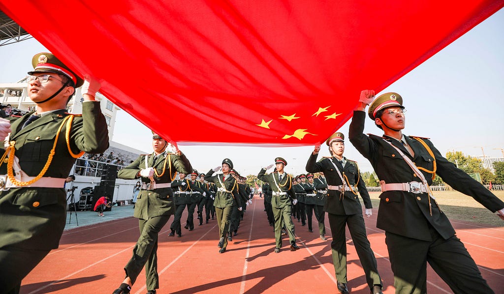 Freshmen from Huaiyin Normal University perform a military training demonstration in Huai’an, Jiangsu Province, China, October 22, 2022. Photo by Cynthia Lee/Alamy Stock Photo