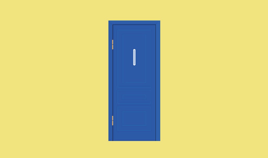 A door without lock and handle, having a rectangular white shape on its upper-part