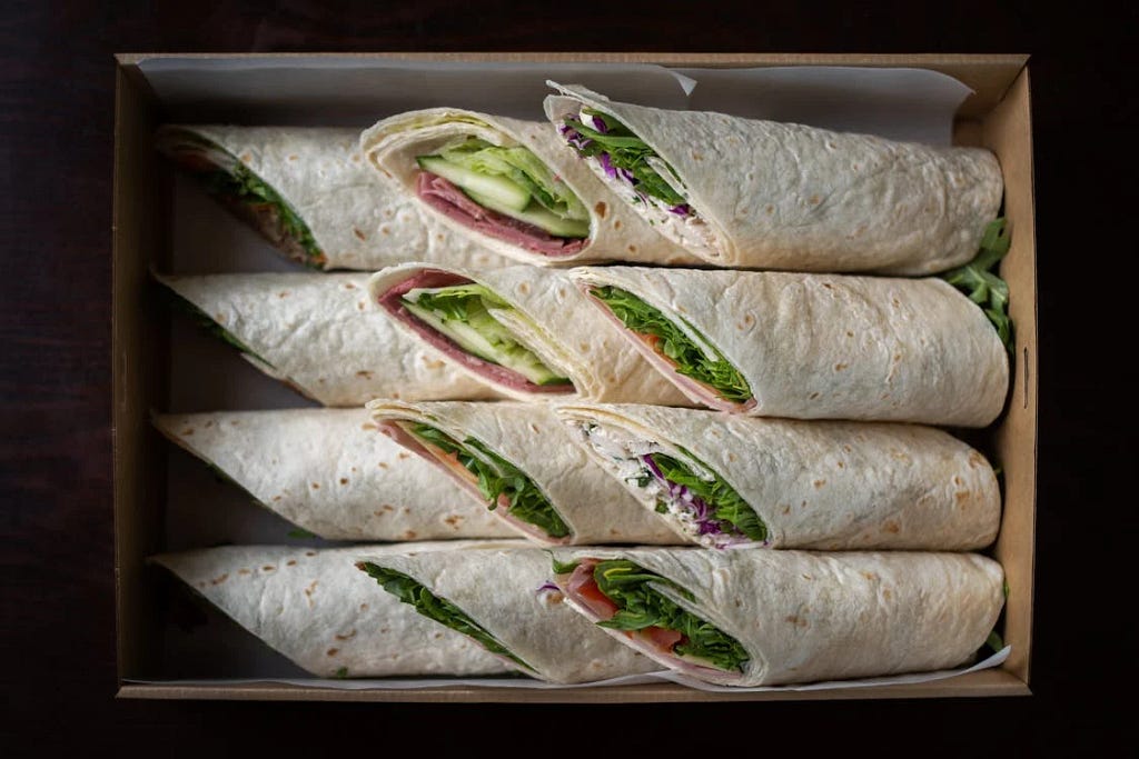 a bunch of wraps in a box