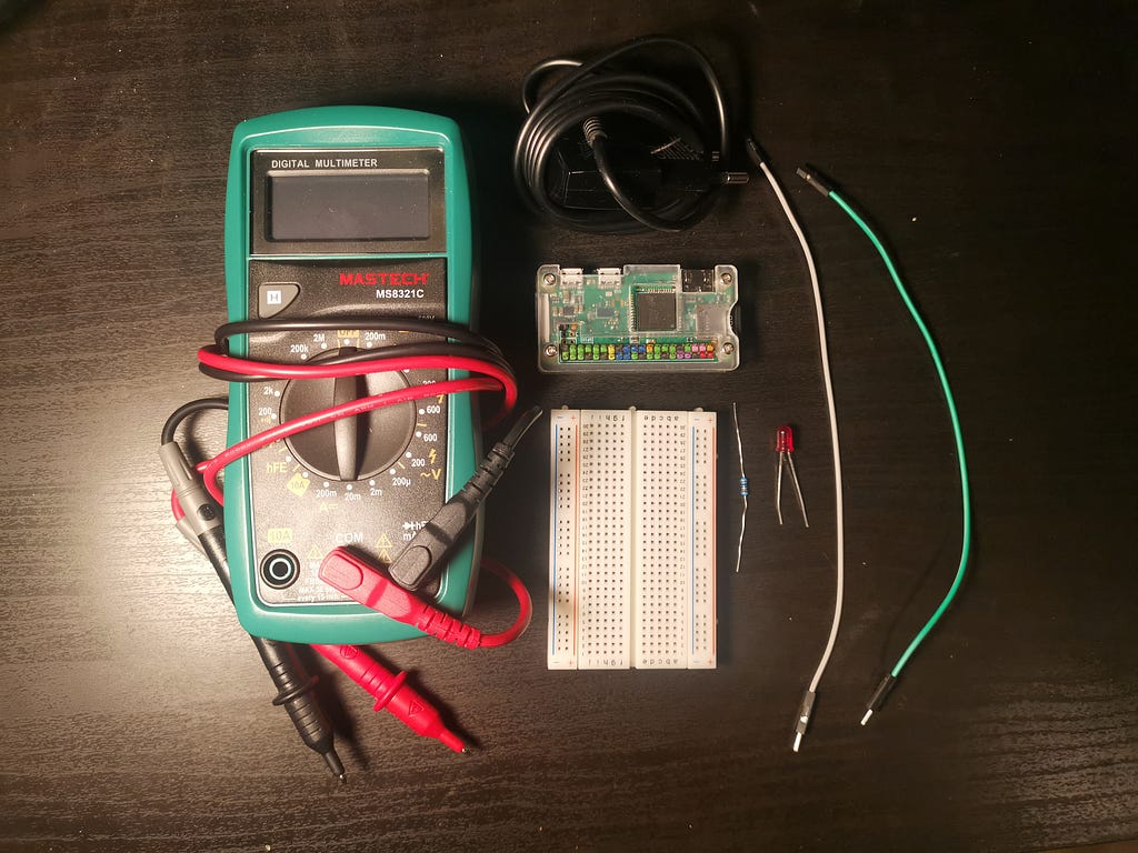 Raspberry Pi Zero, solderless breadboard, LED, 330Ω resistor, 2 female-to-male jumper wires, power supply and multimeter