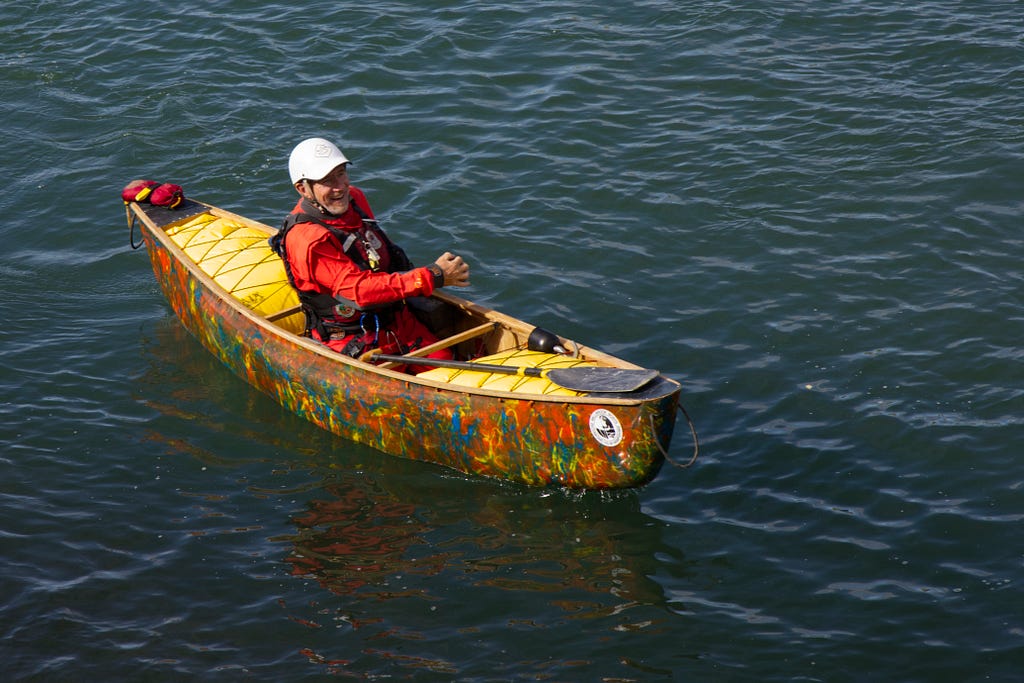 Solo canoeist floating on water.