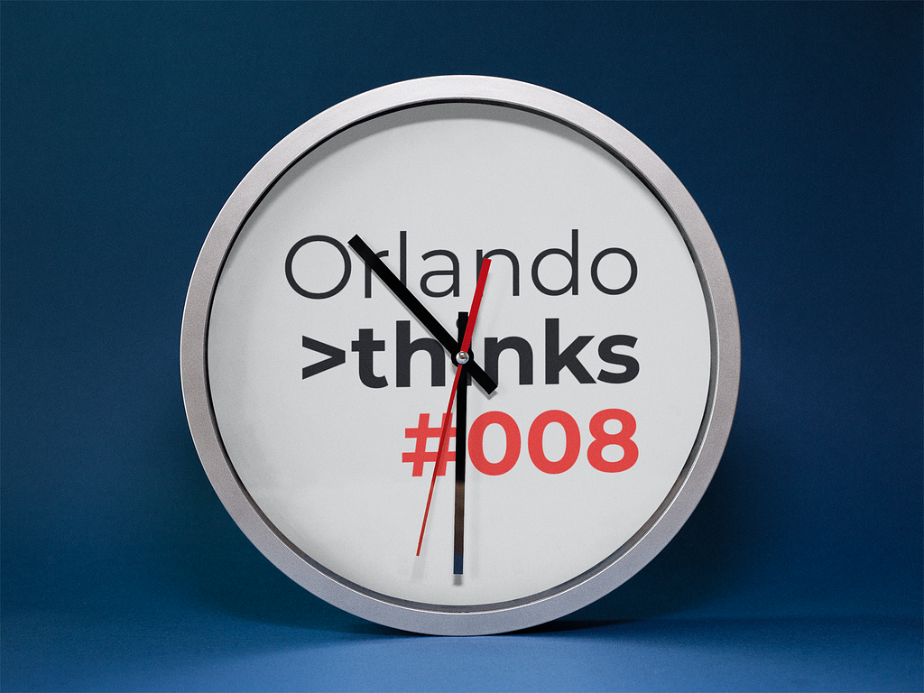 A clock showing the time 10:30. The background of the clock contains the words “Orlando thinks #008”