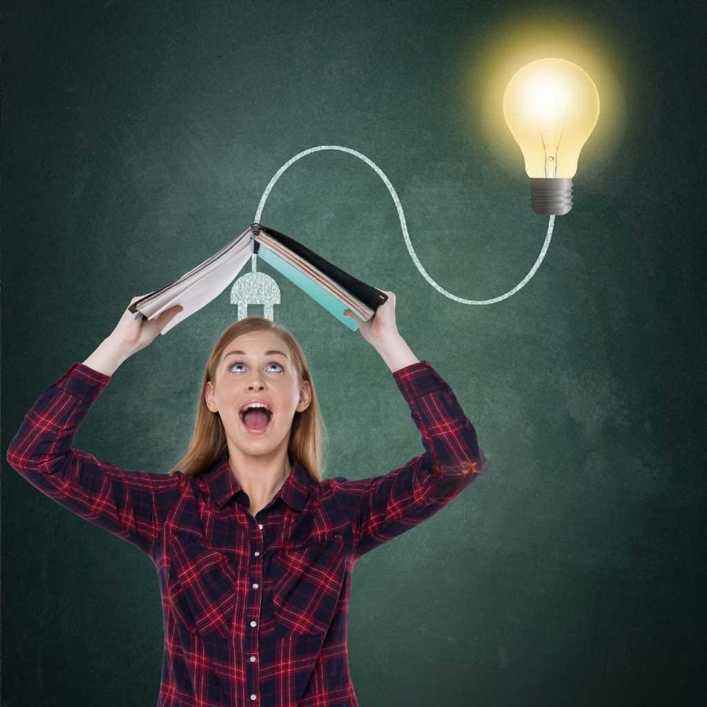 Girl Holding a book signifying how to become smart