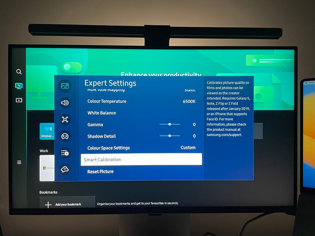 Samsung monitor’s on-screen display with the ‘Smart Calibration’ option enabled while displaying the smart TV Home screen.
