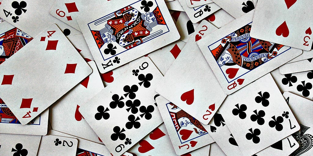 Playing cards scattered face-up