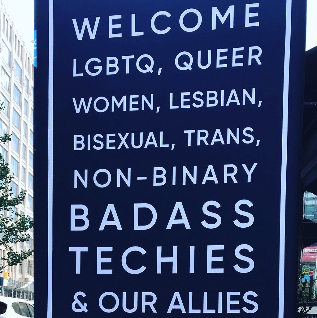 “Welcome LGBTQ, queer women, lesbian, bisexual, trans, non-binary badass techies & our allies to the #LWTSummit” opening sign