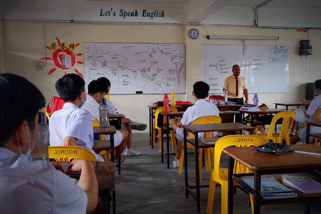 Teaching English in a classroom at Chinese school