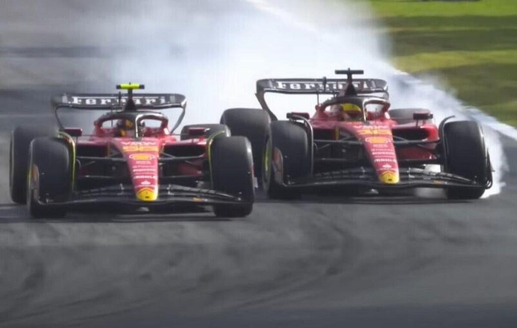 The Ferrari’s of Carlos Sainz and Charles Leclerc racing into turn 1 at Monza. Carlos has the inside line and Charles is right beside him with a tyre locked and smoking under braking.