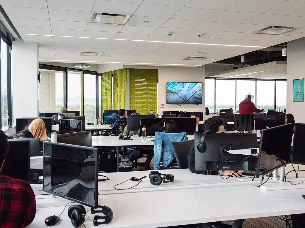 An image showing the office workspace at a moderation site office operated by Cognizant