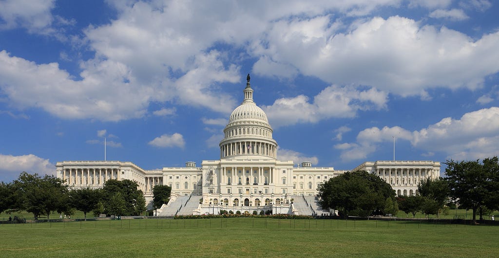 U.S. Capitol Building on a cloudy yet pleasant day.