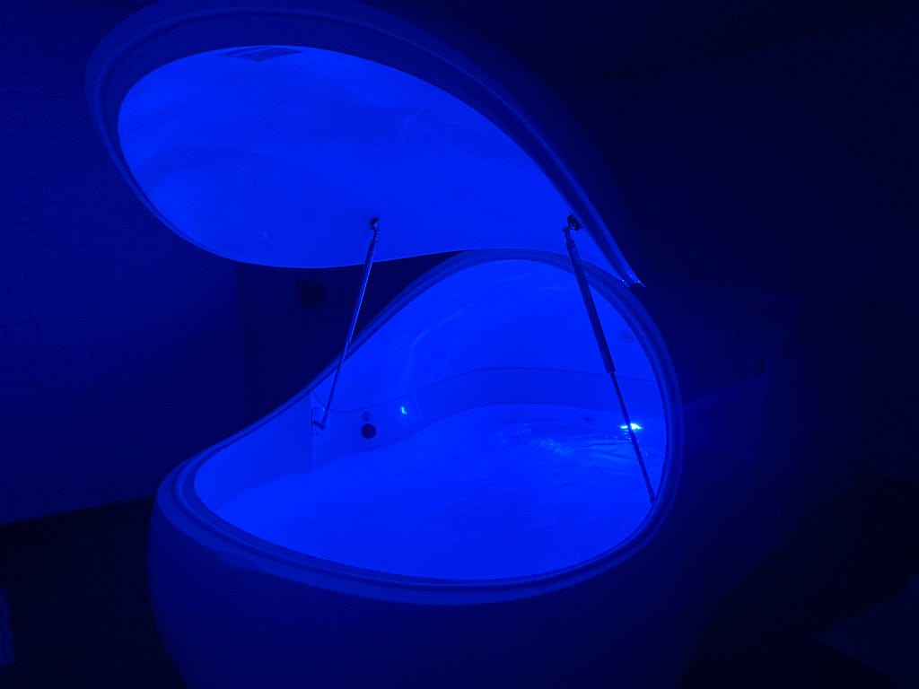 Image of floatation tank with blue light