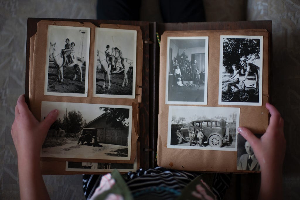 An old and worn family photo album