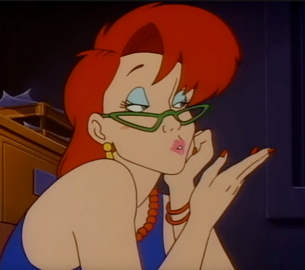 A still from The Real Ghostbusters showing Janine blowing a kiss.
