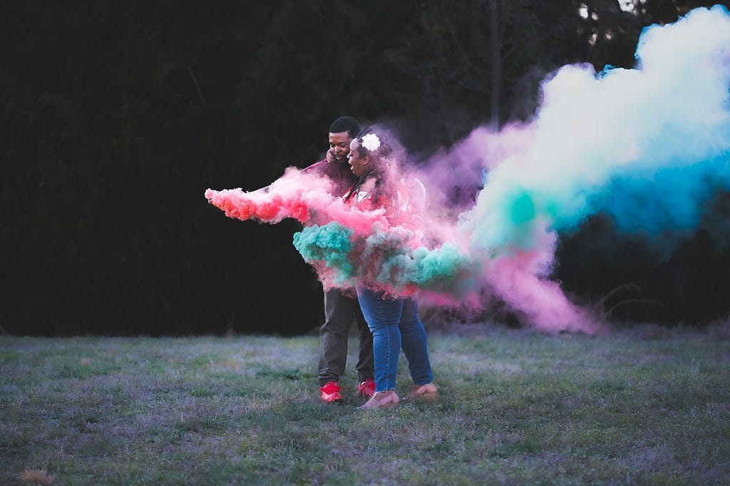 Colored smoke at gender reveal. Photo by alisa dyson on pixabay.com