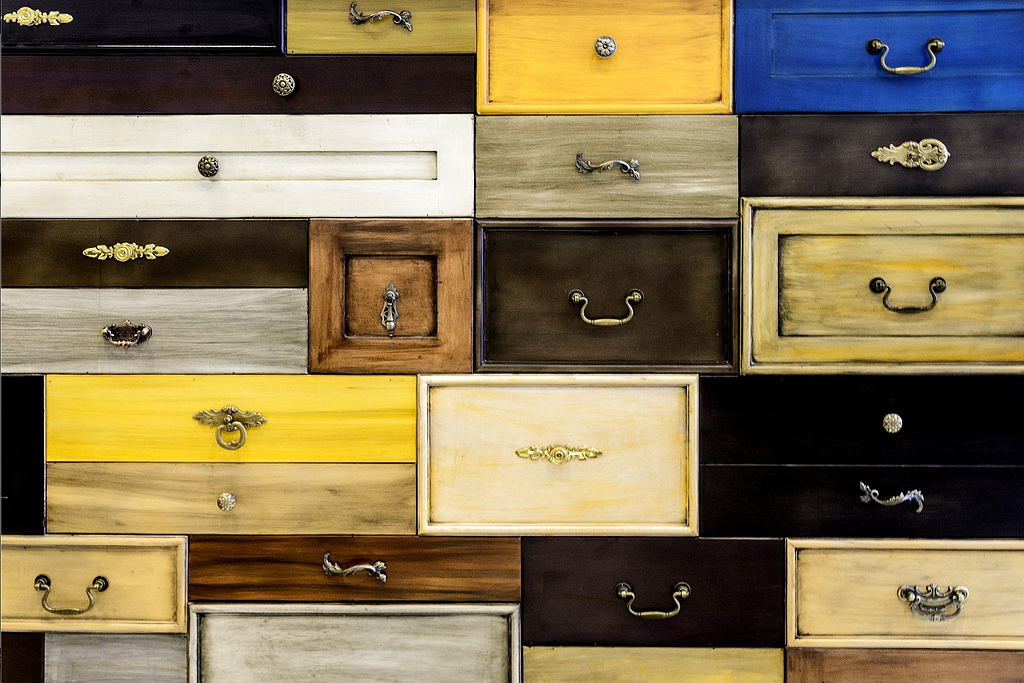 An image showing multicoloured closed drawers