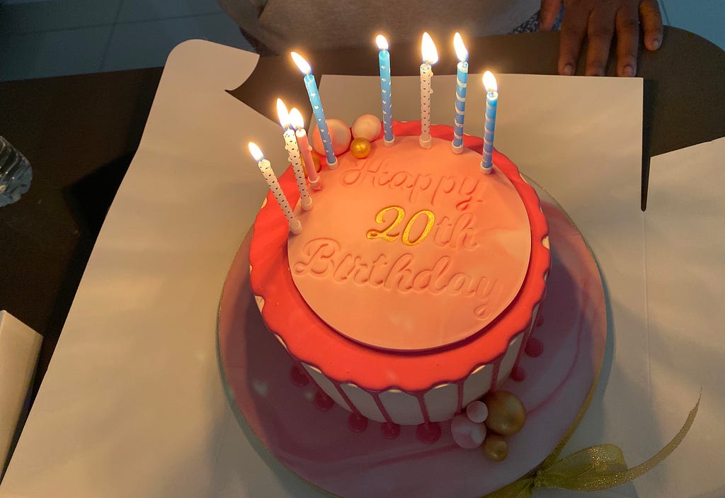 A birthday cake saying ‘Happy 20th Birthday’