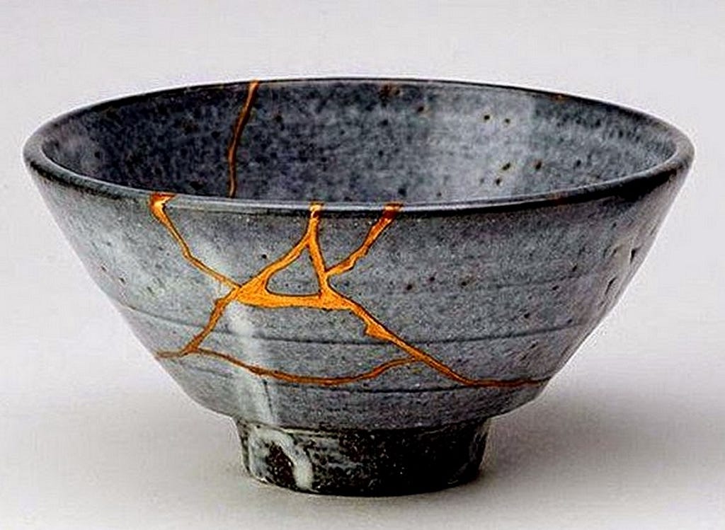 An example of kintsugi. Gold where the broken bowl has been reformed.