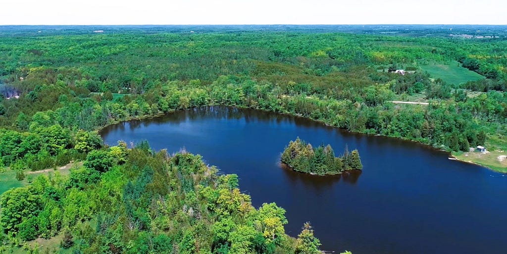 54-acre property includes Curleys Lake, Ontario, estimated 25 acres. The lakefront property boasts a breathtaking setting with trees and natural beauty