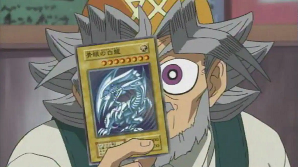 Solomon Muto holding a black text name Blue-Eyes White Dragon in the second anime