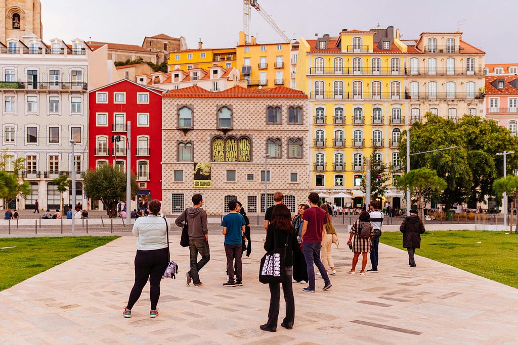 Group of people in a square in Lisbon.