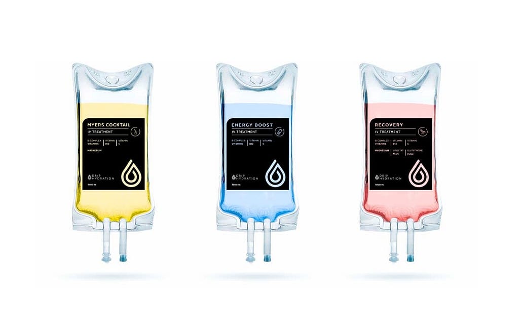 Three IV bags of vitamin cocktails with different labels: Myers Cocktail, Energy Boost, and Recovery.