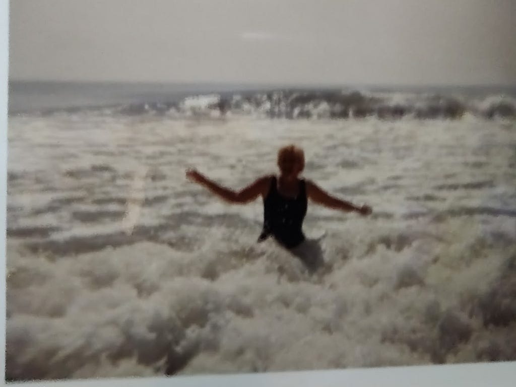 Picture of Mom enjoying the wave breaking on the shore