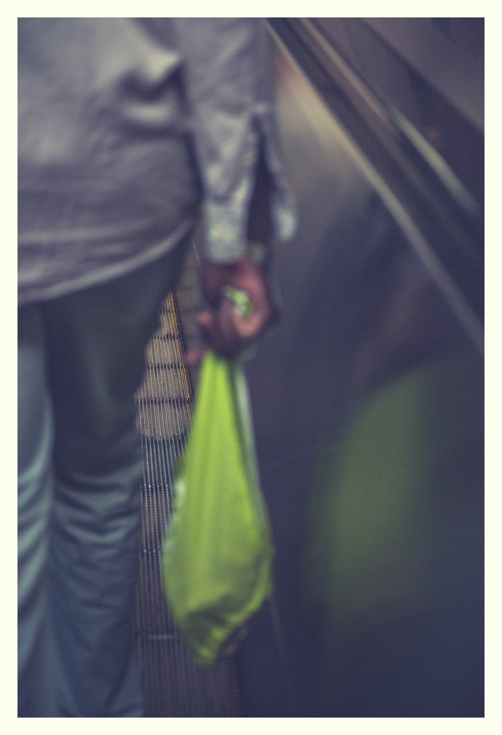 Man carrying a shopping bag.
