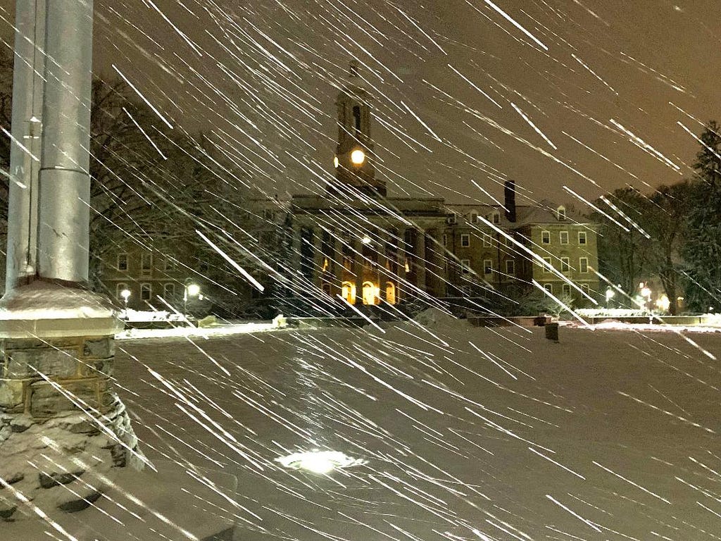 Penn State’s primary administrative building, Old Main, lights up a snowstorm on Wednesday Jan. 23, 2022. For some, this storm was their first experience with snow. (Photo: James Engel)