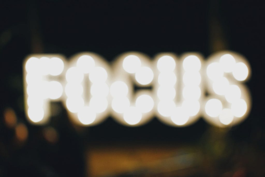 The word focus in lights but blurred