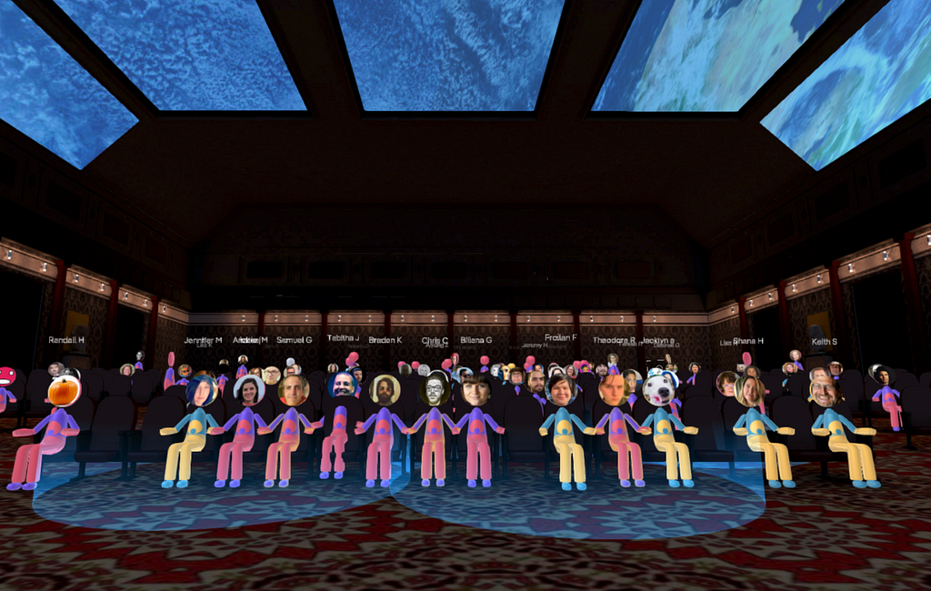 Sundance-colored avatars fill a darkened virtual theater. Each avatar has a photo of the user’s face, but the bodies are all teal-yellow or purple-pink, matching the colors in the Sundance festival website, poster, and video bumpers that played before every film.
