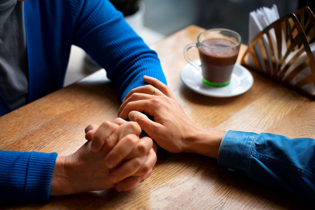 a photo of hands holding each other