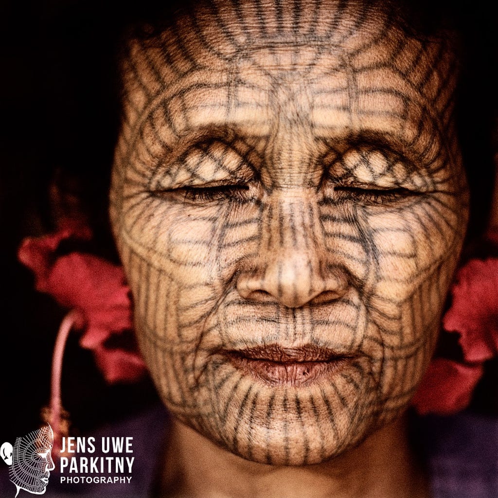 Laytu Chin woman Ma Hla Oo with a spider-web like tattoo that spans over her entire face. The Laytu live in Western Myanmar.