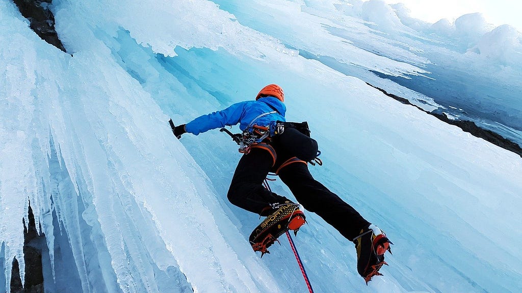 Man climbing ice wall