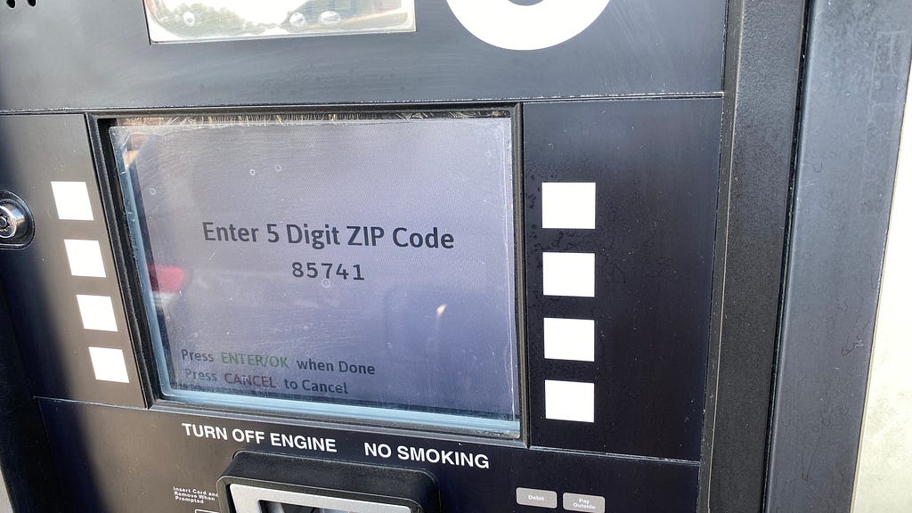 White payment screen at a gas pump that asks you to enter your zip code.