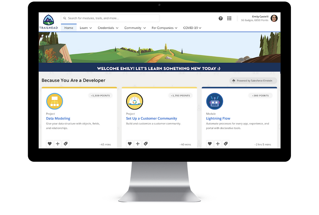 Desktop showing Trailhead. Badges recommended “Because you are a Developer” with new “Powered by Salesforce Einstein” button.