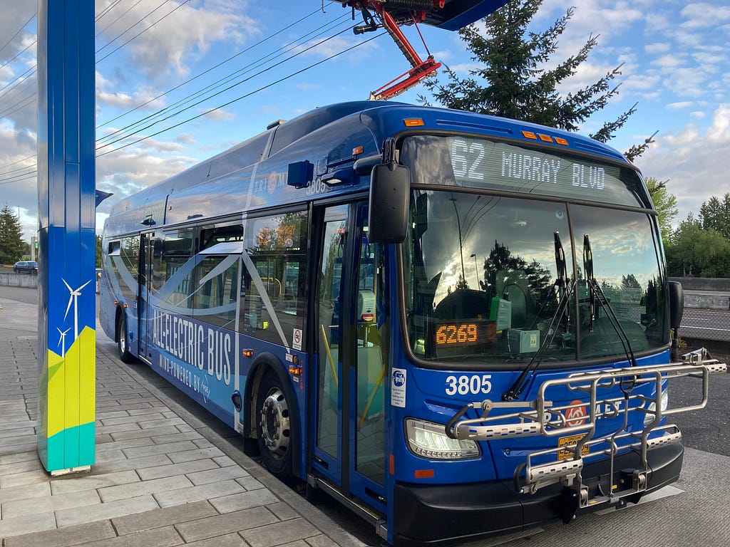 A TriMet 3800 series electric bus being charged at Sunset Transit Center.