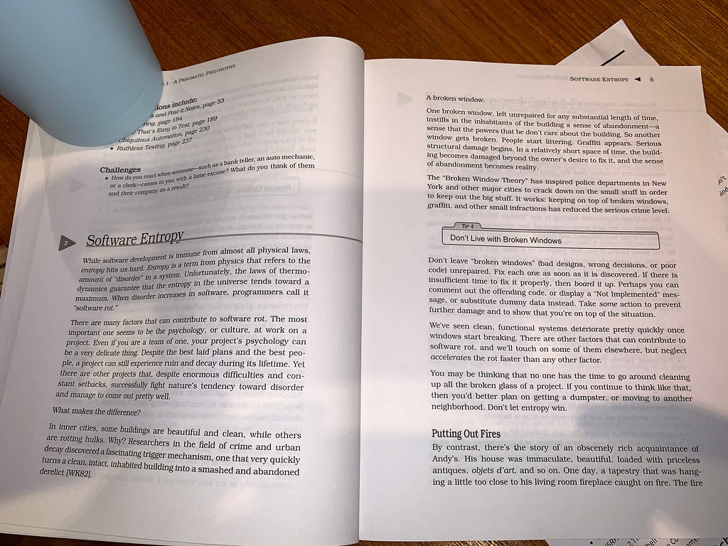 The Pragmatic Programmer book opened to page 4 and 5