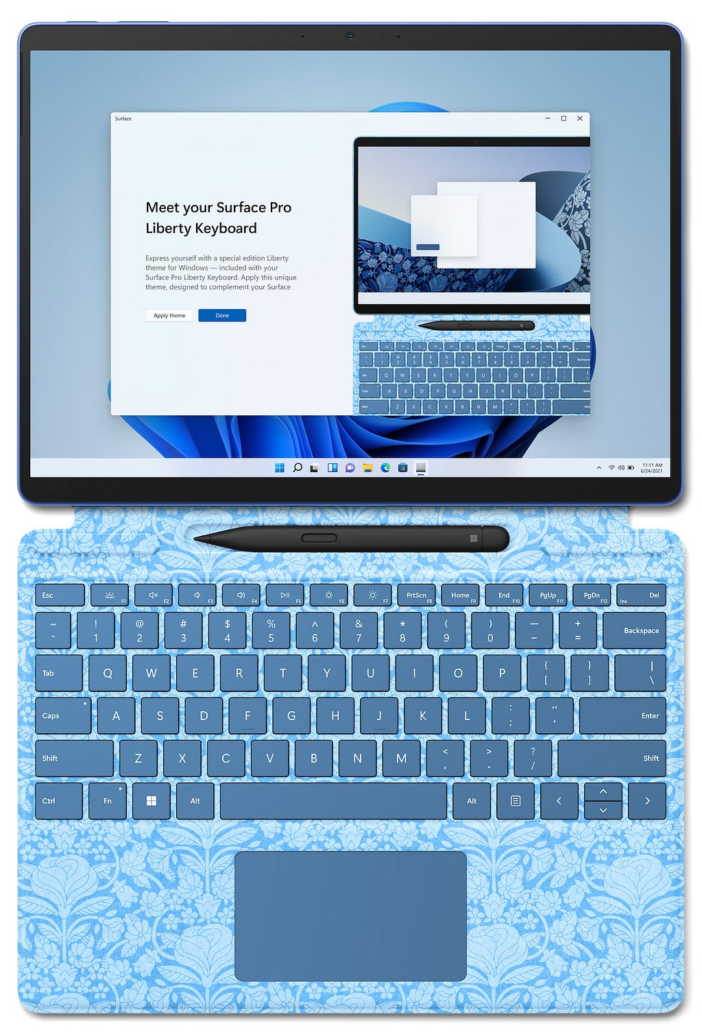 An open laptop with a printed keyboard with a welcome message